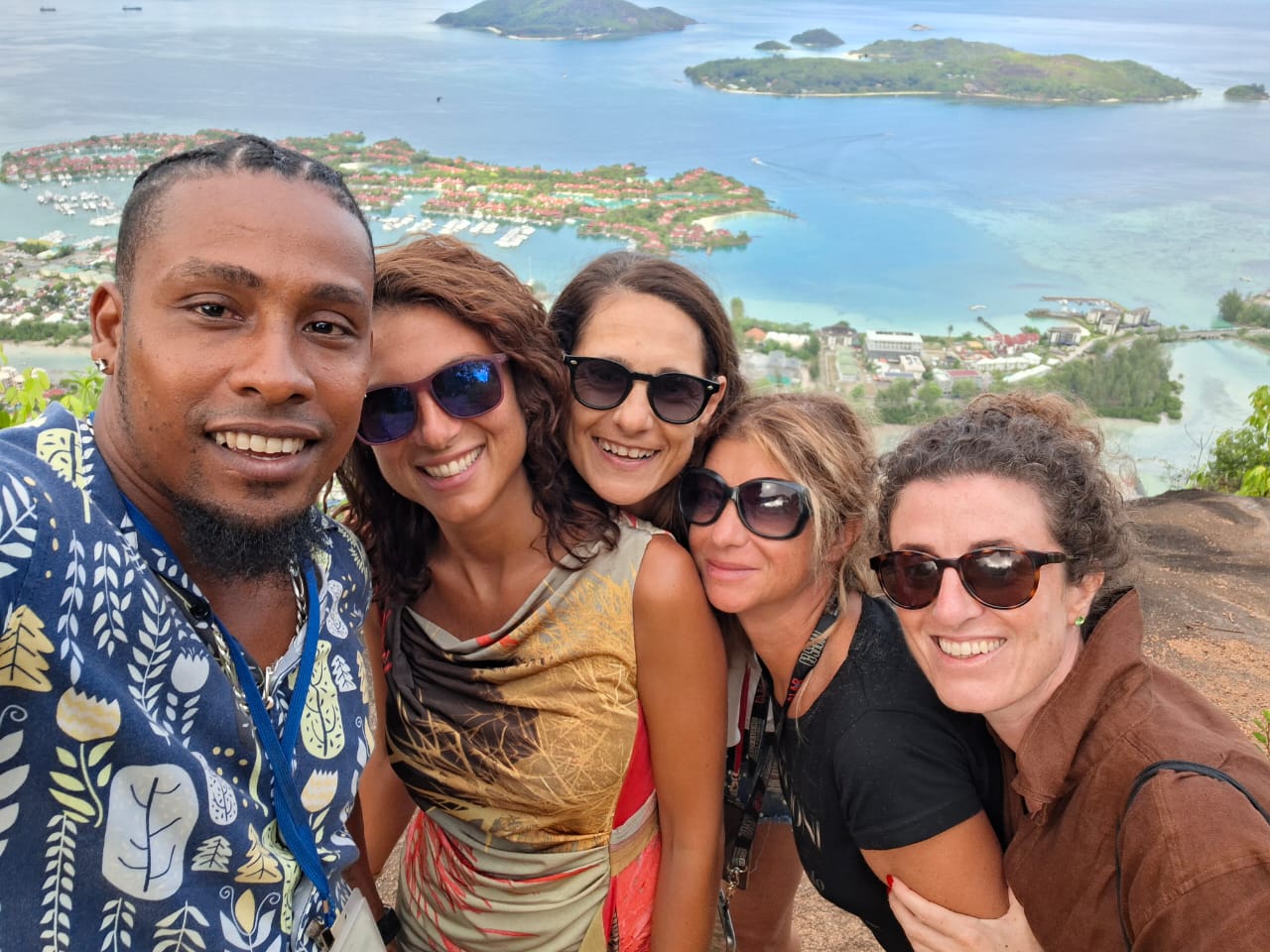 Vel with guests at a viewpoint above Eden Island, Mahé