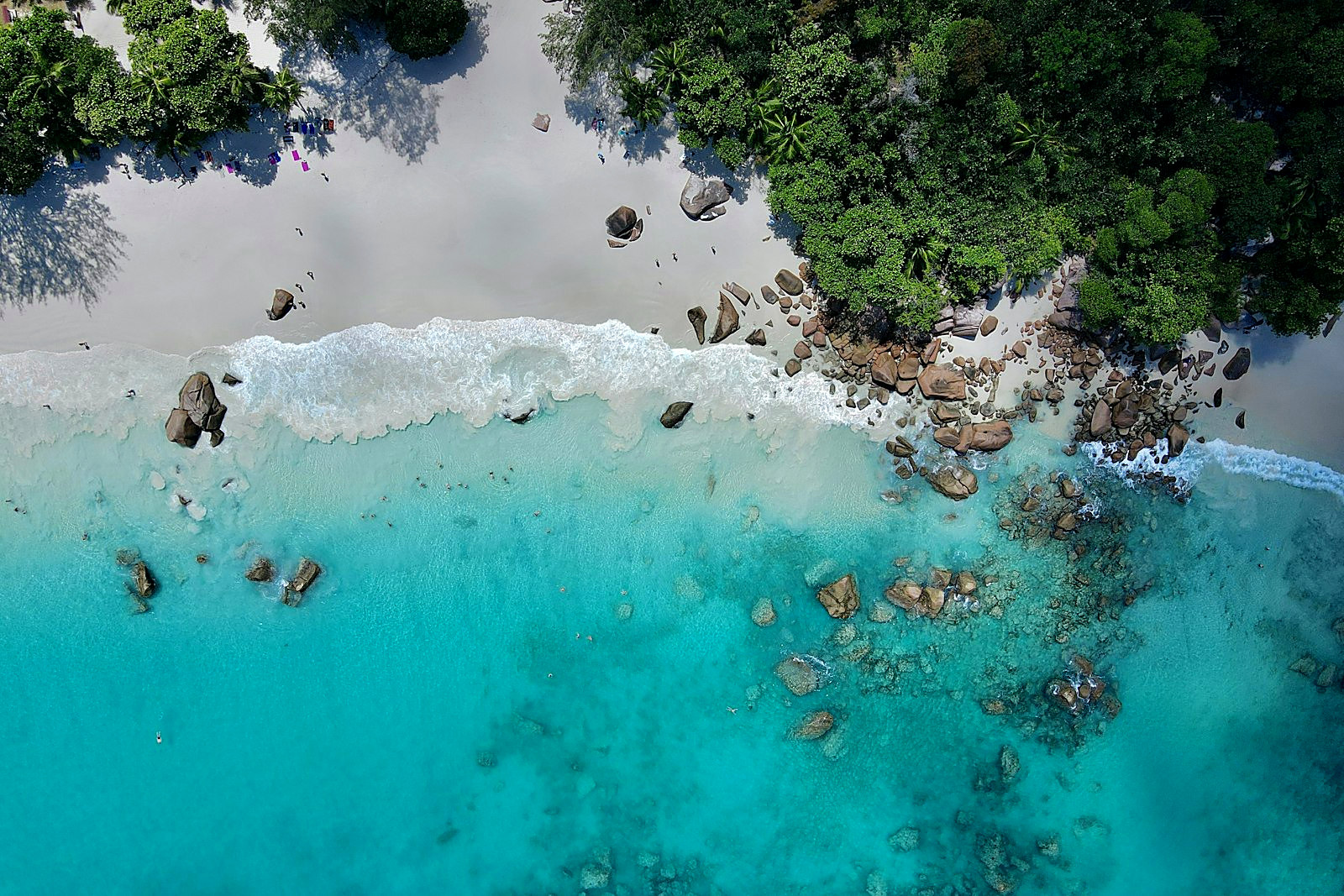 Turquoise bay framed by granite boulders at Anse Intendance